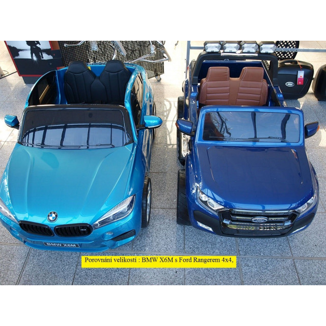 BMW X6 s 2,4G bluetooth DO, EVA kolesami, otváracími dverami,12V, čalunenou vyšívanou sedačkou, lakované čiernou farbou