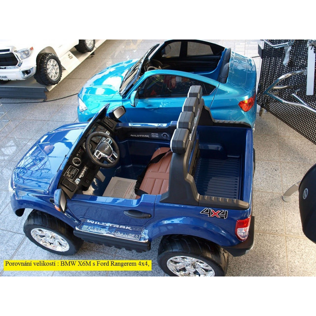 BMW X6 s 2,4G bluetooth DO, EVA kolesami, otváracími dverami,12V, čalunenou vyšívanou sedačkou, lakované čiernou farbou