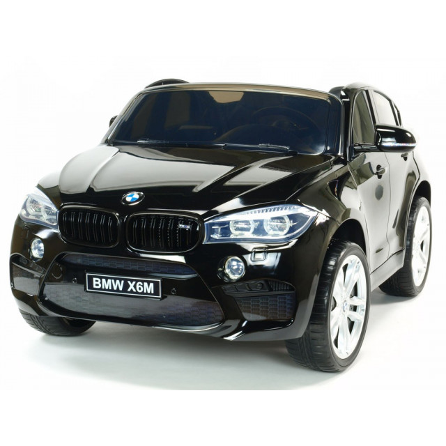 BMW X6 s 2,4G bluetooth DO, EVA kolesami, otváracími dverami,12V, čalunenou vyšívanou sedačkou, lakované čiernou farbou