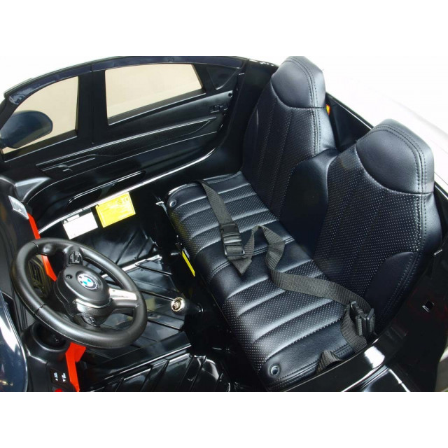 BMW X6 s 2,4G bluetooth DO, EVA kolesami, otváracími dverami,12V, čalunenou vyšívanou sedačkou, lakované čiernou farbou