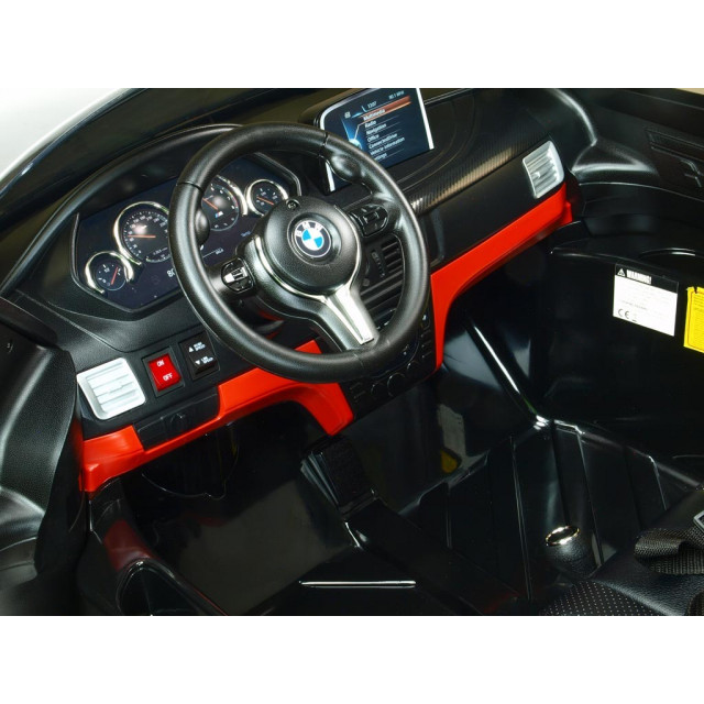 BMW X6 s 2,4G bluetooth DO, EVA kolesami, otváracími dverami,12V, čalunenou vyšívanou sedačkou, lakované čiernou farbou