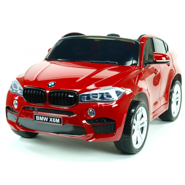 BMW X6 s 2,4G bluetooth DO, EVA kolesami, otváracími dverami,12V, čalunenou vyšívanou sedačkou, lakované čiernou farbou