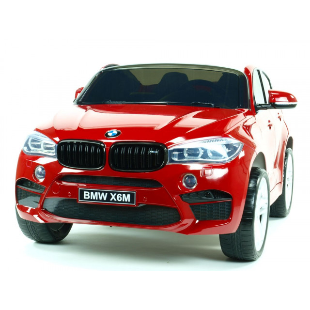 BMW X6 s 2,4G bluetooth DO, EVA kolesami, otváracími dverami,12V, čalunenou vyšívanou sedačkou, lakované čiernou farbou