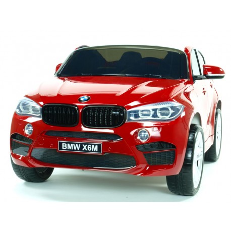 BMW X6 s 2,4G bluetooth DO, EVA kolesami, otváracími dverami,12V, čalunenou vyšívanou sedačkou, lakované čiernou farbou