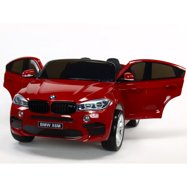 BMW X6 s 2,4G bluetooth DO, EVA kolesami, otváracími dverami,12V, čalunenou vyšívanou sedačkou, lakované čiernou farbou