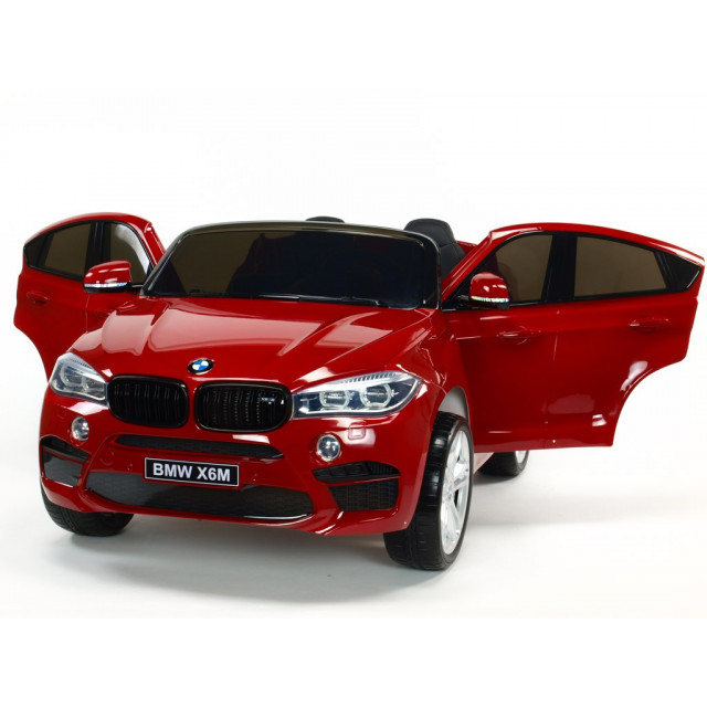 BMW X6 s 2,4G bluetooth DO, EVA kolesami, otváracími dverami,12V, čalunenou vyšívanou sedačkou, lakované čiernou farbou