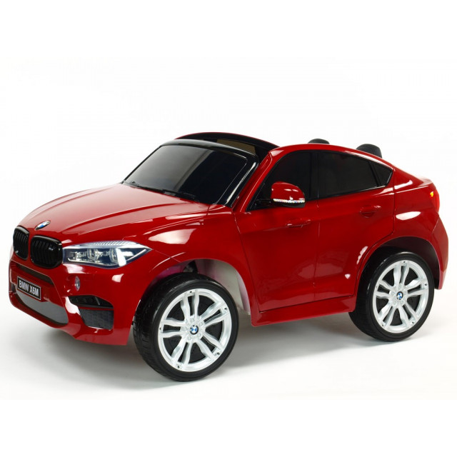 BMW X6 s 2,4G bluetooth DO, EVA kolesami, otváracími dverami,12V, čalunenou vyšívanou sedačkou, lakované čiernou farbou