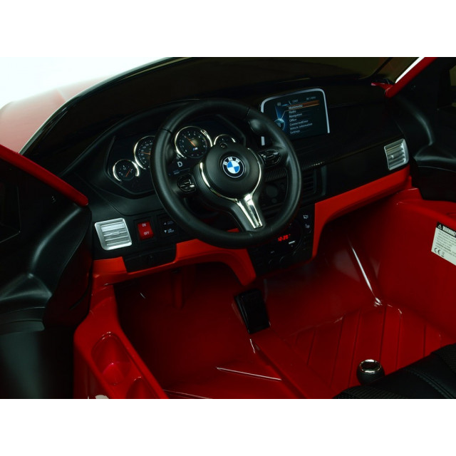 BMW X6 s 2,4G bluetooth DO, EVA kolesami, otváracími dverami,12V, čalunenou vyšívanou sedačkou, lakované čiernou farbou