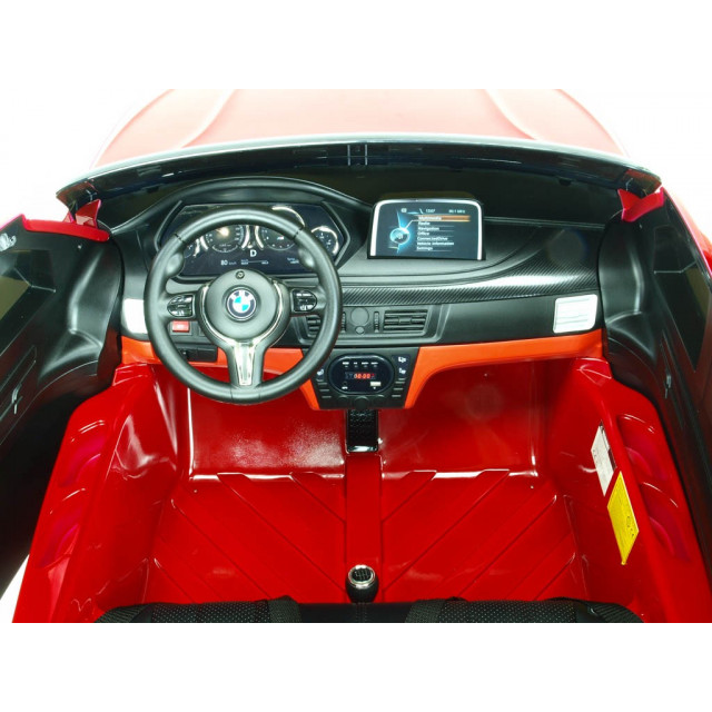 BMW X6 s 2,4G bluetooth DO, EVA kolesami, otváracími dverami,12V, čalunenou vyšívanou sedačkou, lakované čiernou farbou