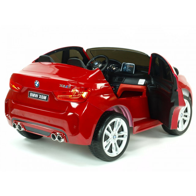 BMW X6 s 2,4G bluetooth DO, EVA kolesami, otváracími dverami,12V, čalunenou vyšívanou sedačkou, lakované čiernou farbou