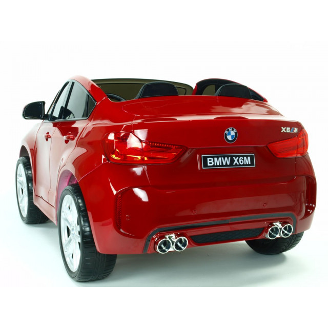 BMW X6 s 2,4G bluetooth DO, EVA kolesami, otváracími dverami,12V, čalunenou vyšívanou sedačkou, lakované čiernou farbou