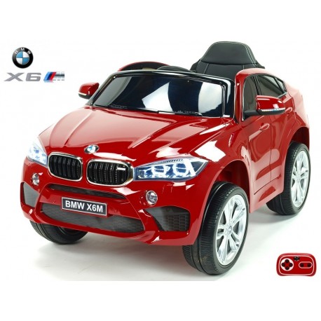 BMW X6 s 2,4G bluetooth DO, EVA kolesami, otváracími dverami,12V, čalunenou vyšívanou sedačkou, lakované čiernou farbou