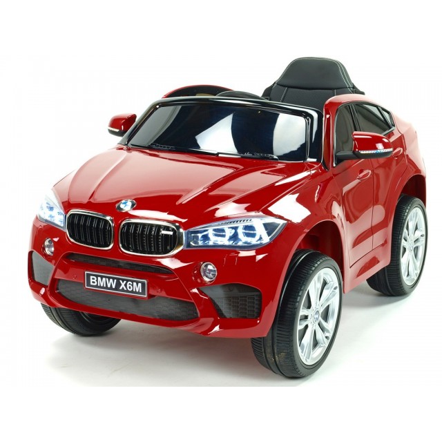 BMW X6 s 2,4G bluetooth DO, EVA kolesami, otváracími dverami,12V, čalunenou vyšívanou sedačkou, lakované čiernou farbou