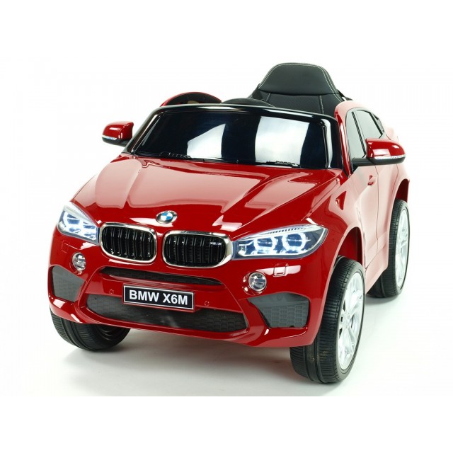 BMW X6 s 2,4G bluetooth DO, EVA kolesami, otváracími dverami,12V, čalunenou vyšívanou sedačkou, lakované čiernou farbou