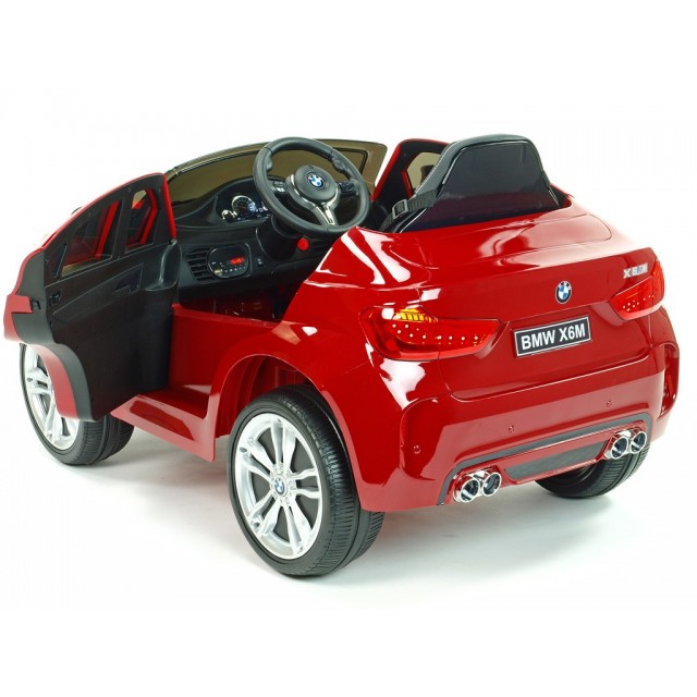 BMW X6 s 2,4G bluetooth DO, EVA kolesami, otváracími dverami,12V, čalunenou vyšívanou sedačkou, lakované čiernou farbou