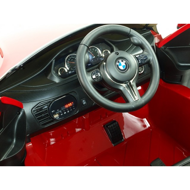 BMW X6 s 2,4G bluetooth DO, EVA kolesami, otváracími dverami,12V, čalunenou vyšívanou sedačkou, lakované čiernou farbou