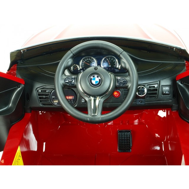 BMW X6 s 2,4G bluetooth DO, EVA kolesami, otváracími dverami,12V, čalunenou vyšívanou sedačkou, lakované čiernou farbou