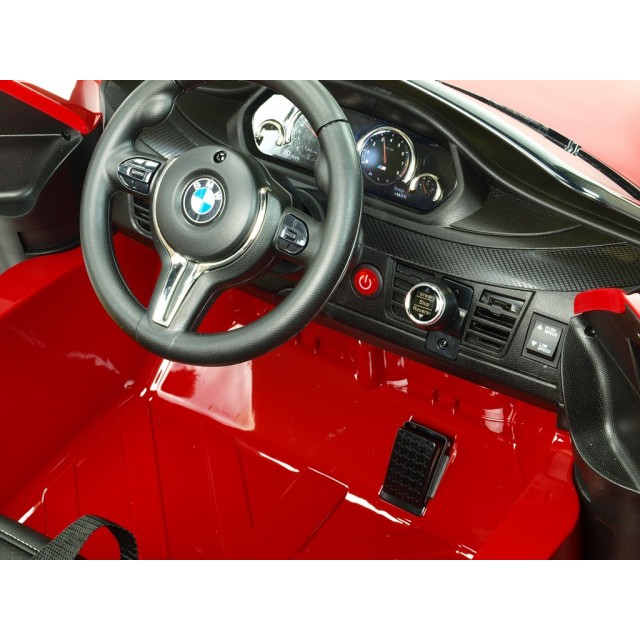 BMW X6 s 2,4G bluetooth DO, EVA kolesami, otváracími dverami,12V, čalunenou vyšívanou sedačkou, lakované čiernou farbou