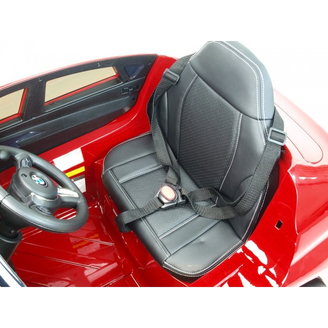 BMW X6 s 2,4G bluetooth DO, EVA kolesami, otváracími dverami,12V, čalunenou vyšívanou sedačkou, lakované čiernou farbou