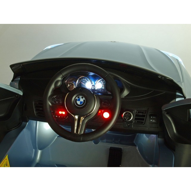 BMW X6 s 2,4G bluetooth DO, EVA kolesami, otváracími dverami,12V, čalunenou vyšívanou sedačkou, lakované čiernou farbou