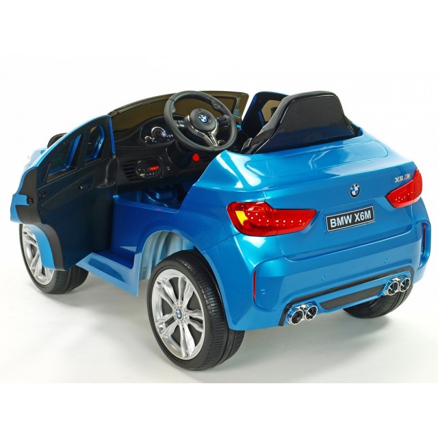 BMW X6 s 2,4G bluetooth DO, EVA kolesami, otváracími dverami,12V, čalunenou vyšívanou sedačkou, lakované čiernou farbou