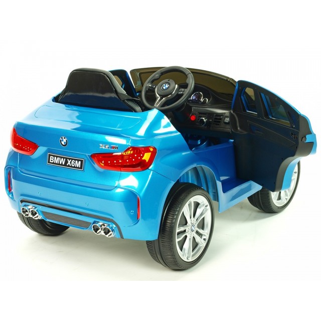 BMW X6 s 2,4G bluetooth DO, EVA kolesami, otváracími dverami,12V, čalunenou vyšívanou sedačkou, lakované čiernou farbou