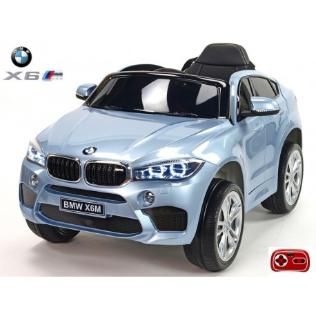 BMW X6 s 2,4G bluetooth DO, EVA kolesami, otváracími dverami,12V, čalunenou vyšívanou sedačkou, lakované čiernou farbou