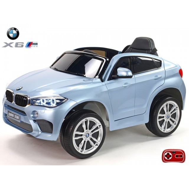 BMW X6 s 2,4G bluetooth DO, EVA kolesami, otváracími dverami,12V, čalunenou vyšívanou sedačkou, lakované čiernou farbou