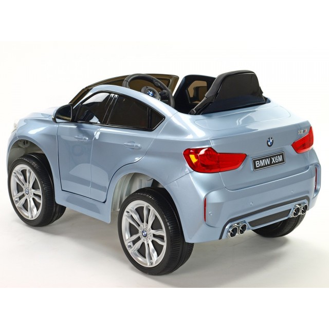 BMW X6 s 2,4G bluetooth DO, EVA kolesami, otváracími dverami,12V, čalunenou vyšívanou sedačkou, lakované čiernou farbou