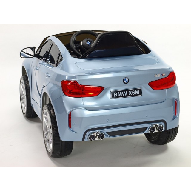 BMW X6 s 2,4G bluetooth DO, EVA kolesami, otváracími dverami,12V, čalunenou vyšívanou sedačkou, lakované čiernou farbou