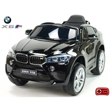 BMW X6 s 2,4G bluetooth DO, EVA kolesami, otváracími dverami,12V, čalunenou vyšívanou sedačkou, lakované čiernou farbou