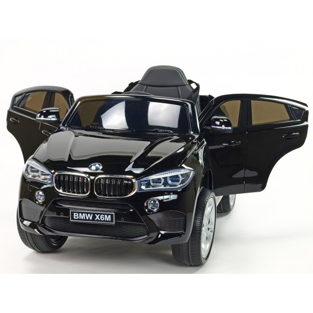 BMW X6 s 2,4G bluetooth DO, EVA kolesami, otváracími dverami,12V, čalunenou vyšívanou sedačkou, lakované čiernou farbou
