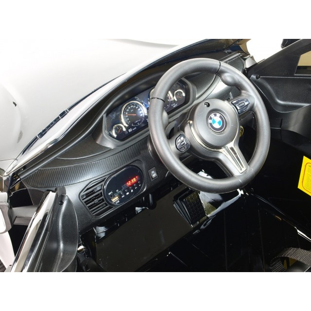 BMW X6 s 2,4G bluetooth DO, EVA kolesami, otváracími dverami,12V, čalunenou vyšívanou sedačkou, lakované čiernou farbou