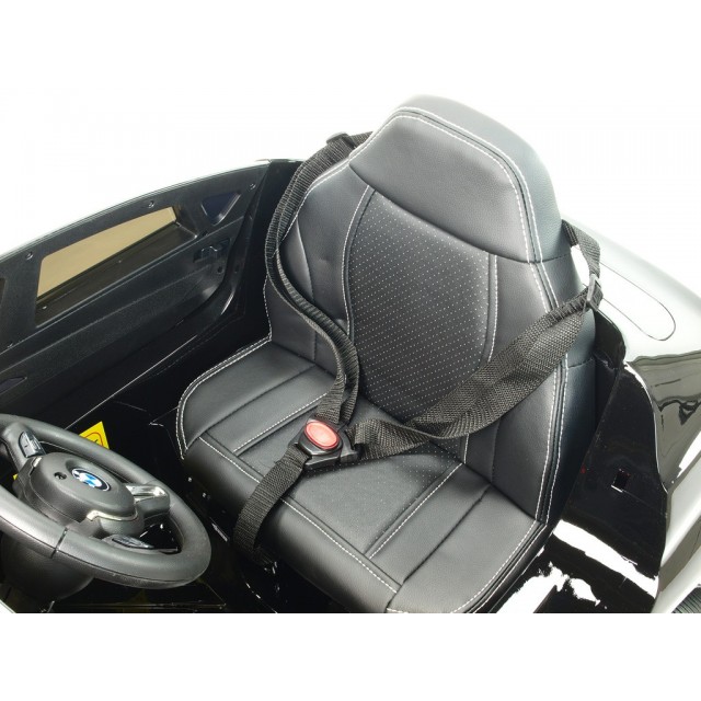 BMW X6 s 2,4G bluetooth DO, EVA kolesami, otváracími dverami,12V, čalunenou vyšívanou sedačkou, lakované čiernou farbou