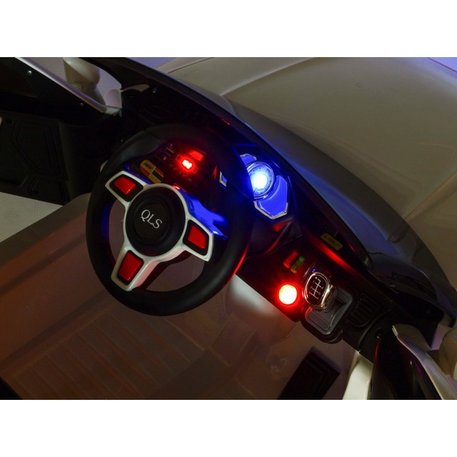 BMW X6 s 2,4G bluetooth DO, EVA kolesami, otváracími dverami,12V, čalunenou vyšívanou sedačkou, lakované čiernou farbou